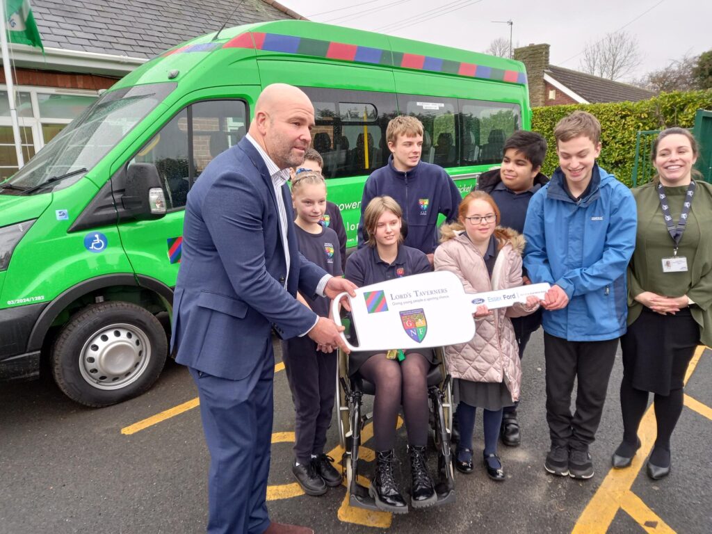 CEO of Lincolnshire County Cricket, Martyn Dobson, hands over the keys to the minibus